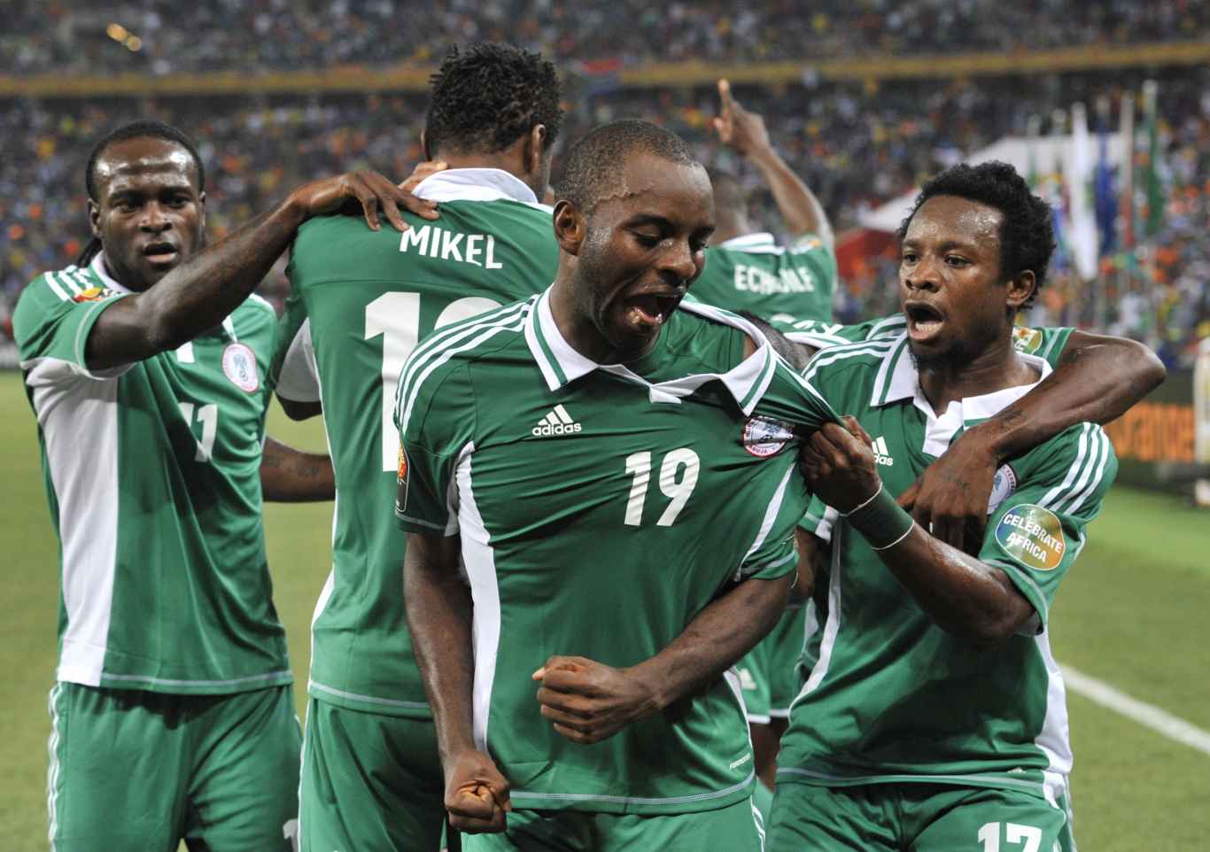 Nigeria's forward Sunday Mba (C) celebrates with teammates after scoring the opening goal against Burkina Faso during the 2013 African Cup of Nations final football match between Burkina Faso and Nigeria on February 10, 2013 at Soccer City stadium in Johannesburg.